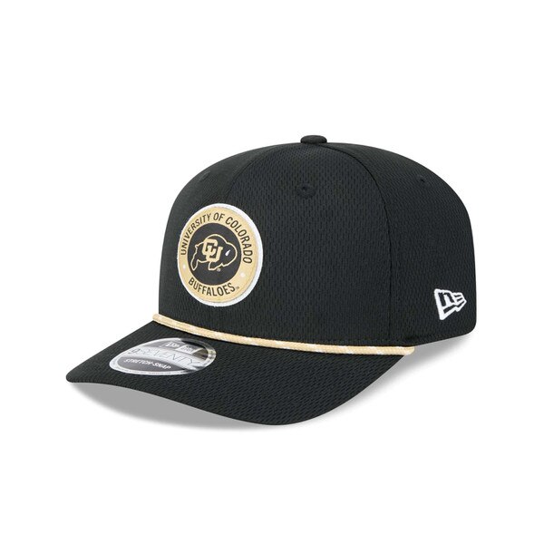 Front angled view of black CU Buffaloes New Era hat with embroidered circular logo and gold rope detail across brim