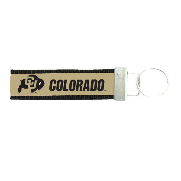 A vegas gold fabric keytag with an attached keyring, featuring black accents and black "Colorado" lettering, with a C-U Buffalo logo.